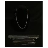 1074	8 STERLING SILVER CHAINS, 1.145 , LONGEST CHAIN APPROXIMATELY 30 IN