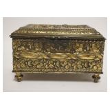 1076	METAL JEWELRY CASKET BOX W/EMBOSSED IMAGES OF MAN COURTING A WOMAN, SOME WEAR TO FINISH, MARKED