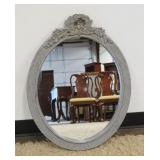 1158	OVAL WALL MIRROR IN REEDED FRAME WITH FLORAL CREST, APPROXIMATELY 22 IN X 29 IN