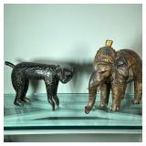 CARVED ANIMALS | Including: wood carved monkey and composite painted elephant. - l. 12.5 x w. 6 x h.