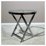 CHROME & GLASS SIDE TABLE | Modern end table having a chrome faux folding design with a round glass 