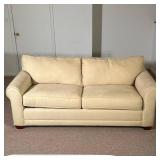 2 CUSHION SLEEPER SOFA | Cream 2 cushion sleeper sofa with pullout bed. - h. 28 x l. 74 x d. 37 in