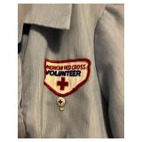 Badge and pin on Red Cross uniform