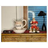BASEMENT - Coca-Cola Collectibles Lot with Ceramic Pitcher, Santa Figurine, 3D Glasses, Lamp, and Tapestry