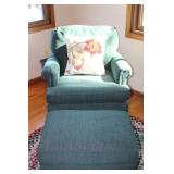 Green Armchair with Matching Ottoman and Decorative Pillow