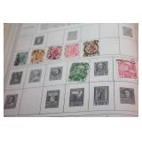 The New World Wide Postage Stamp Album with Assorted Stamps