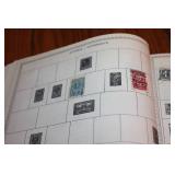 The New World Wide Postage Stamp Album with Assorted Stamps