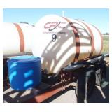 750 gallon poly tank on running gear, with pump and motor