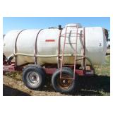 1,000 gallon poly tank on running gear, with pump and motor