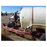 1,000 gallon poly tank on running gear, with pump and motor