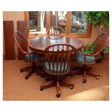 Circle Table and Four Rolling Chairs by Richardson Brothers Company