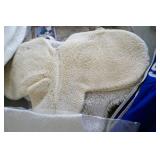 Group of used saddle pads and blanket and comb