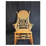 Vintage Wicker Rocking Chair with Intricate Detailing