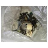 Assortment of Used Small Engine Carburetor Parts and Storage Box