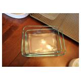 Assortment of Glass and Ceramic Baking Dishes with Kitchen Tools