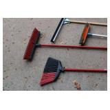 Mixed Lot of Gardening and Cleaning Tools Including Brooms, Rakes, and Extension Cords