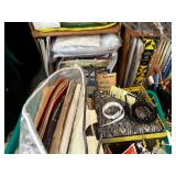 Two Small Bookcases Filled With Crafting Books And Craft Supplies, Including Baskets As Seen In Photo