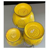 Three Bright Yellow Collanders