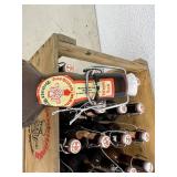 Wood Tote of Empty Beer Bottles