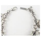 Peace Silver Tone Base Metal Charm Bracelet.