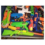 Lot of Nerf guns, bullets, scopes and cross bows