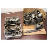 Collection of Vintage Motorcycle Engine Components including Cylinders and Pistons