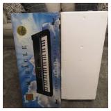 The Miracle Piano Teaching System Keyboard, Power Source, Box and Stand