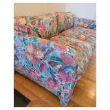 A Hollywood Regency Floral Loveseat.