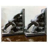 Pair of Men Pushing Against Each other Bookends