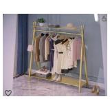 Gold colored clothes rack. Free sta...