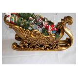 Vintage Decorated Christmas Sleigh with Ornaments and Greenery