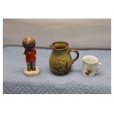 Vintage Decorative Items: Boy Figurine, Stoneware Pitcher, and Cup