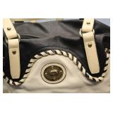 Stylish Black and Cream Handbag with Signature Logo Tag