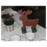 Collection of Holiday Decor Items Including Santa Figures, Cups, and Ornaments