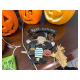 Collection of Fall-Themed Decorations Including Pumpkins and Welcome Sign