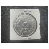 1900 Morgan Dollar, Very Minor Marks in Fields and on Cheek, Minor Ding on Rim, Closer to AU Condition