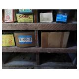 VINTAGE GARAGE SHELF FILLED WITH VINTAGE BOXES OF GOODIES