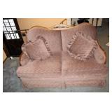 Vintage Two-Seater Loveseat with Decorative Pillows and Wooden Backrest