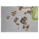 Collection of Vintage Costume Jewelry Including Necklaces, Brooches, and Earrings