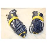 Hockey Gear Set Including Winnwell Sticks, Protective Gloves, and Elbow Pads