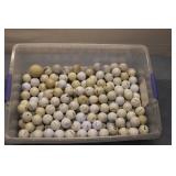 Collection of 100+ Used Golf Balls in Storage Container