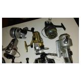 Collection of 11 Fishing Reels including Zebco, True Temper, and Daiwa