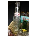 Collection of Vintage Soda Bottles and Glass Containers