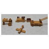 Miniature Wooden figures: (1) Airplane (1) Fire Truck (1) Train (1) Tractor & (1) Decorative Cookie Tin