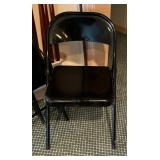 Four Black Folding Chairs