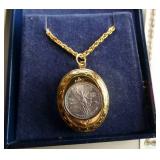 Locket with a 1/20 oz silver coin, cuff links, tie clasps, watch, etc