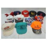 12 caps, including Crown Royal, Mn Twins vintage cap and others