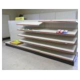 Double sided lozier shelving unit with shelves 12ft 2 in long