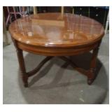 oval wood coffee table. nice shape. 43.5"x 30"