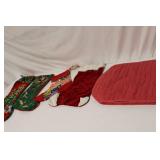 Collection of 8 Vintage Christmas Stockings and Quilted Red Table Mat